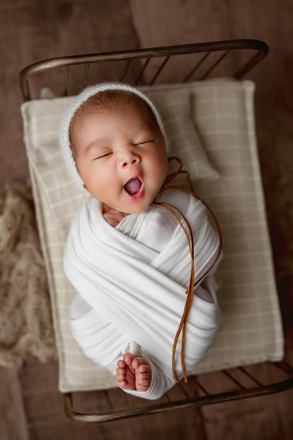 newborn baby boy yawn during Winston salem newborn photoshoot