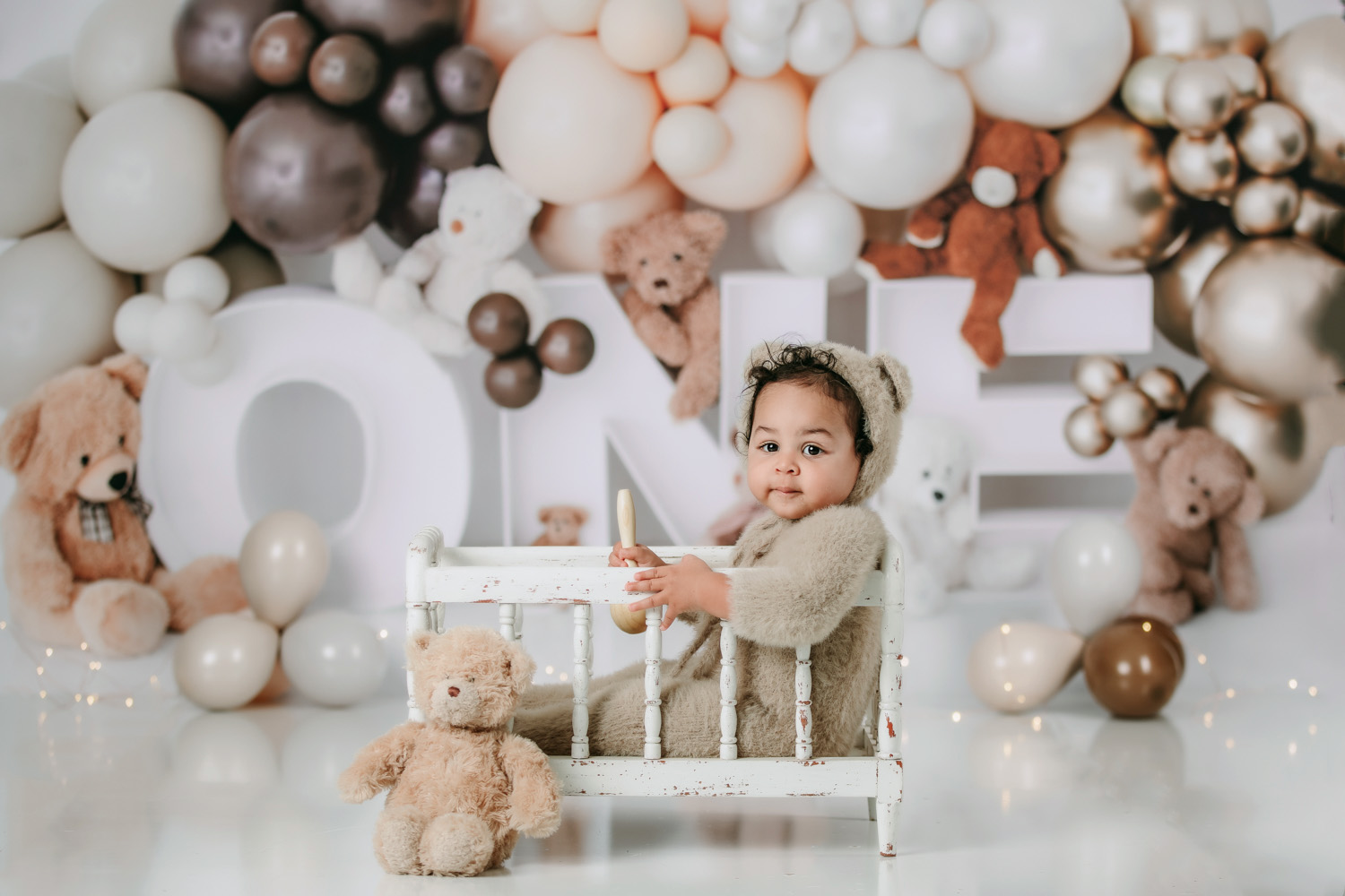 baby-boy-in-bear-suit-during-bear-themed-cake-smash-session-winston-salem-photography-studio