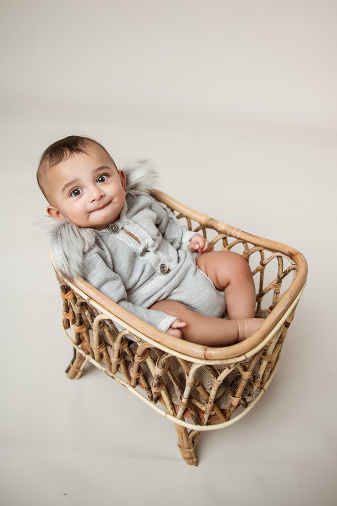 baby-boy-in-wicker-crib-during-winston-salem-milestone-photography-session