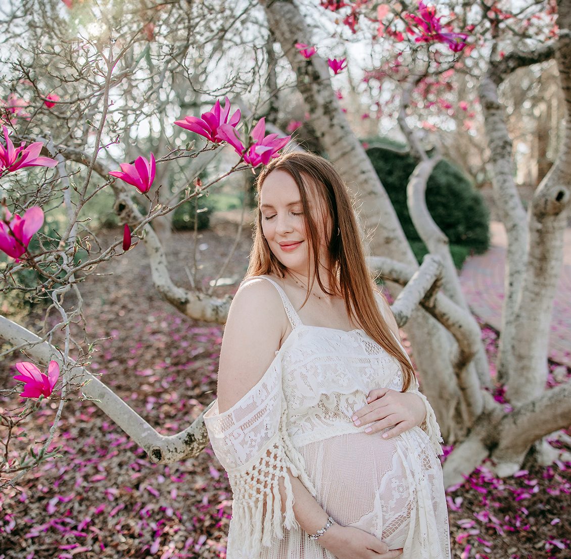 beautiful-maternity-mama-under-magnolia-blossom-wearing-boho-dress-tanglewood-park-clemmons-greensboro-maternity-photosession