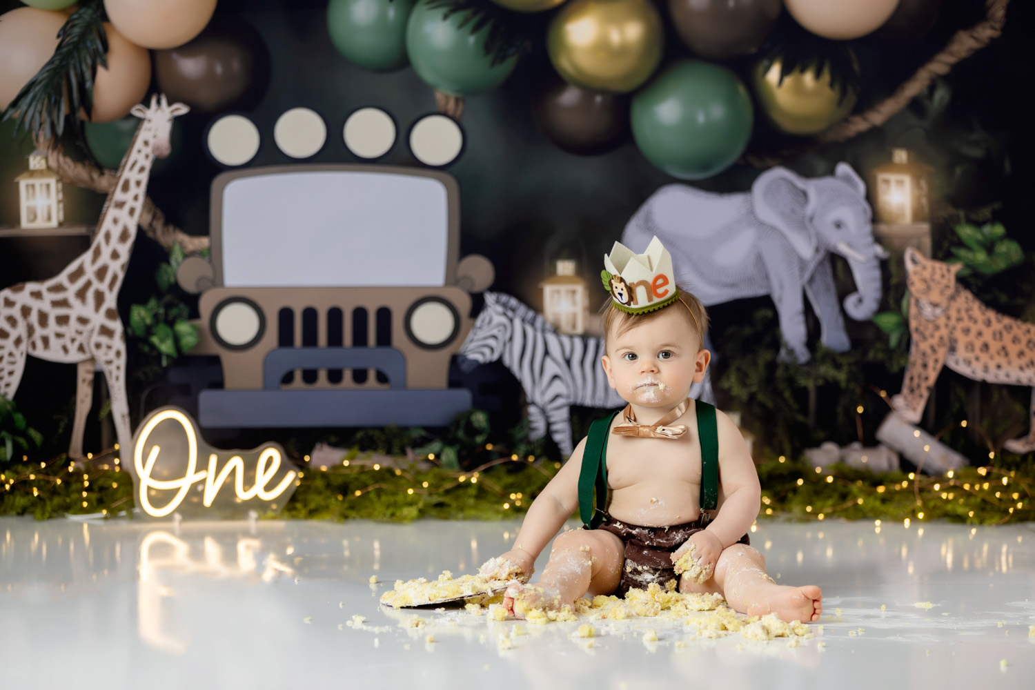 cute-baby-boy-eating-cake-during-winston-salem-wild-one-theme-cake-smash-photoshoot