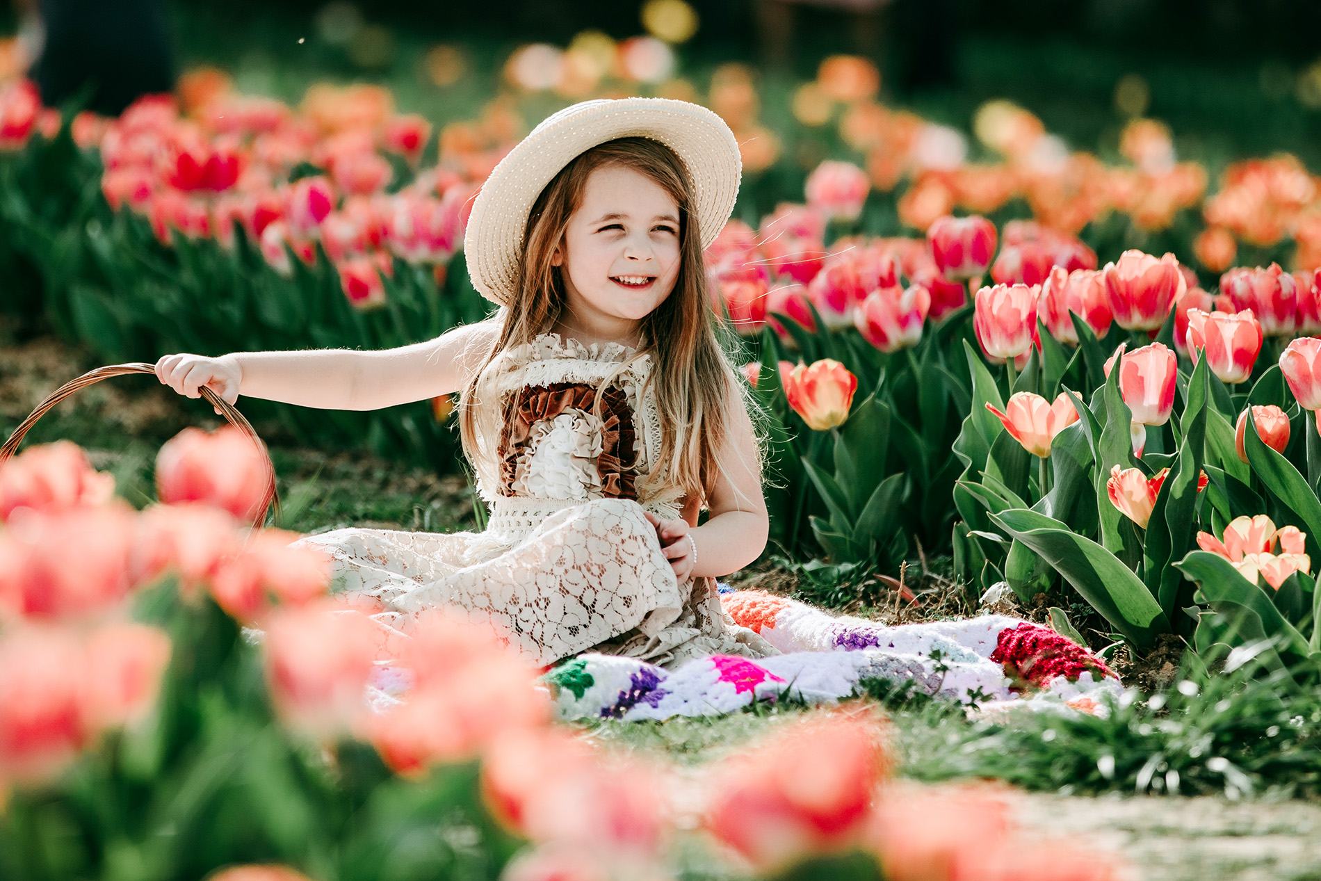baby-girl-in-boho-dress-in-tulips-field-Dewberry-farm-Kernersville-NC-family-photography
