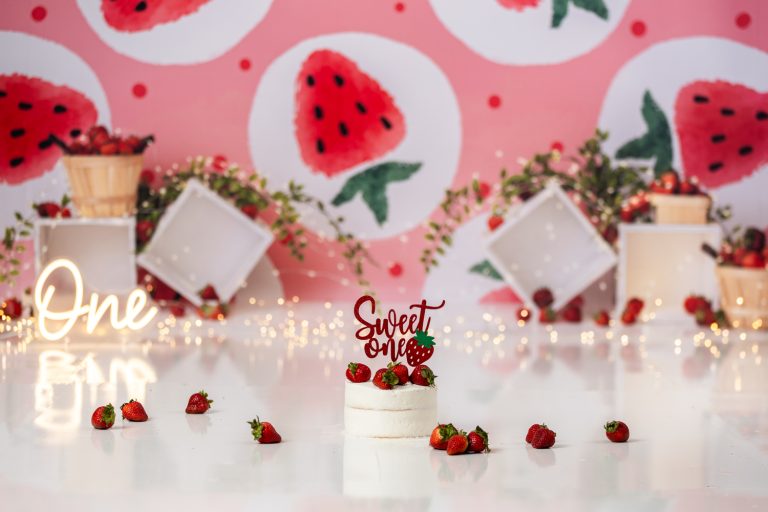strawberry themed cake smash photo session with Winston-salem baby photographer