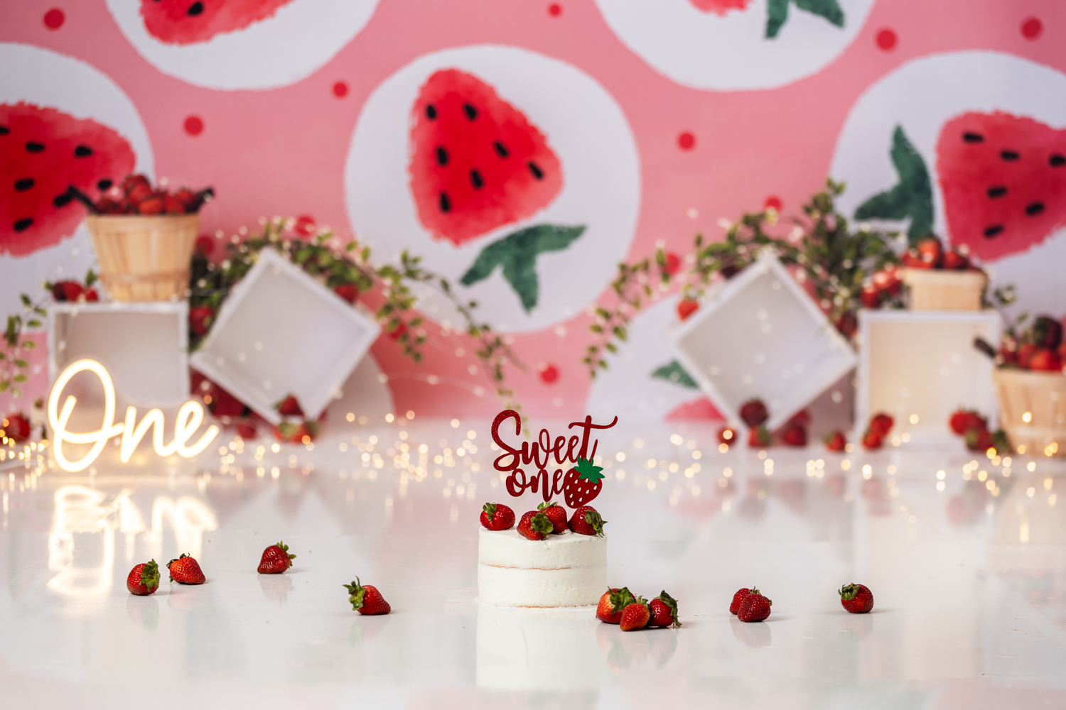 strawberry themed cake smash photo session with Winston-salem baby photographer
