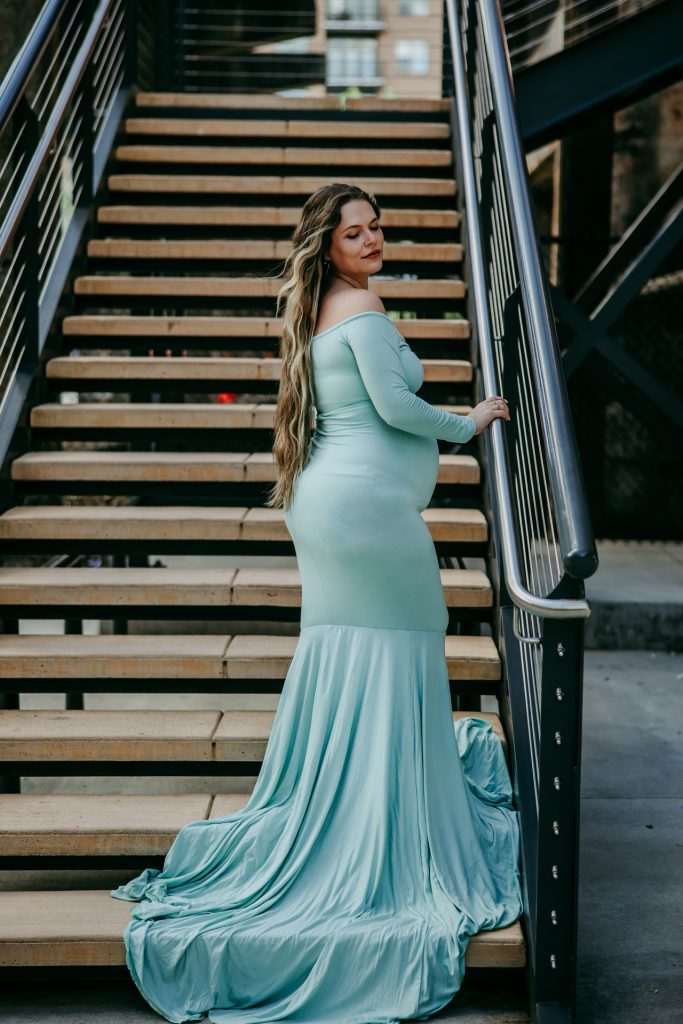 Elegant maternity mother in mint color fitted gown at Innovation quarter, Bailey park downtown winston-salem North Carolina maternity photo session with greensboro maternity photographer