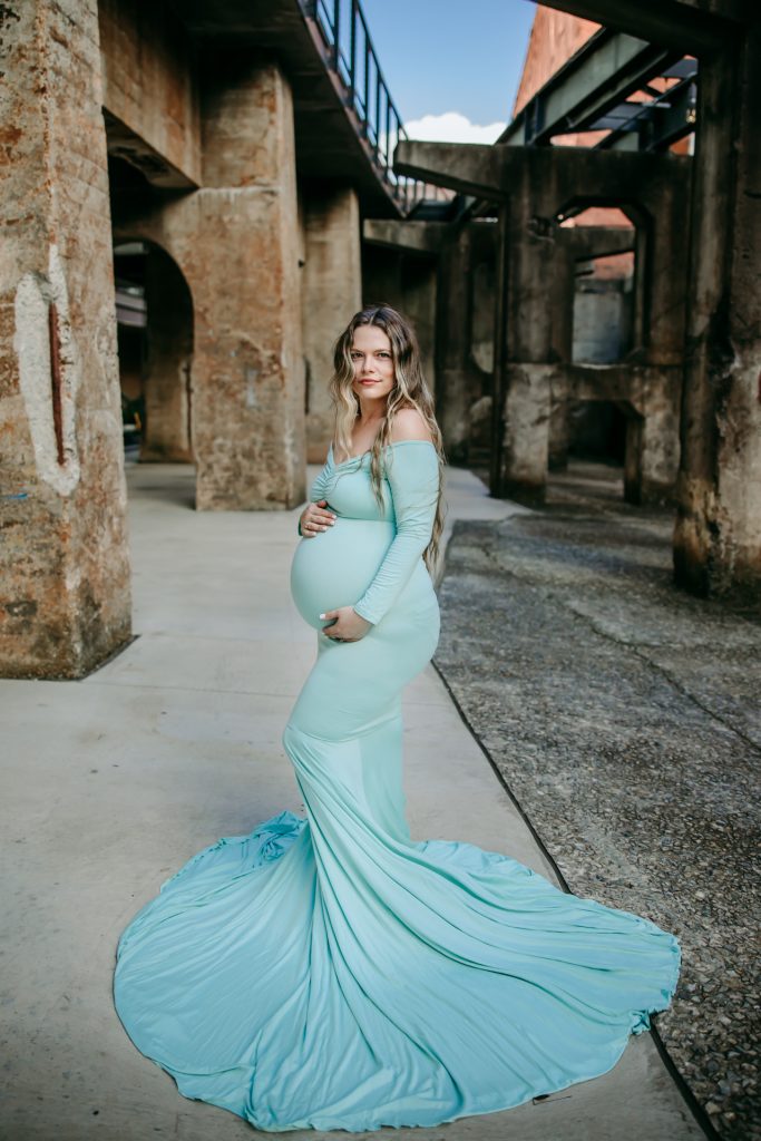 Elegant maternity mother in mint color fitted gown at Innovation quarter, Bailey park downtown winston-salem North Carolina maternity photo session with greensboro maternity photographer