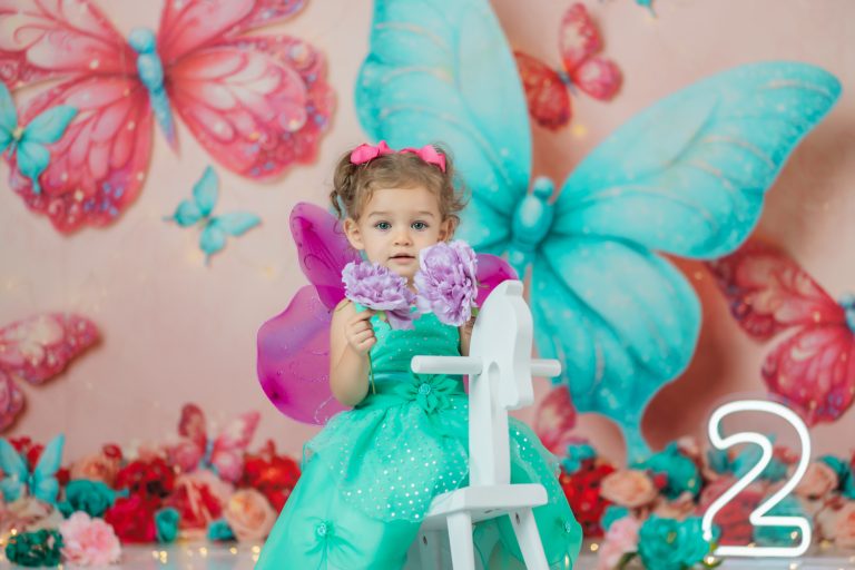 butterfly-Cake-smash-photoshoot-with-cute-baby-girl-in-teal-dress-and-fuchsia-wings-during-greensboro-photographer