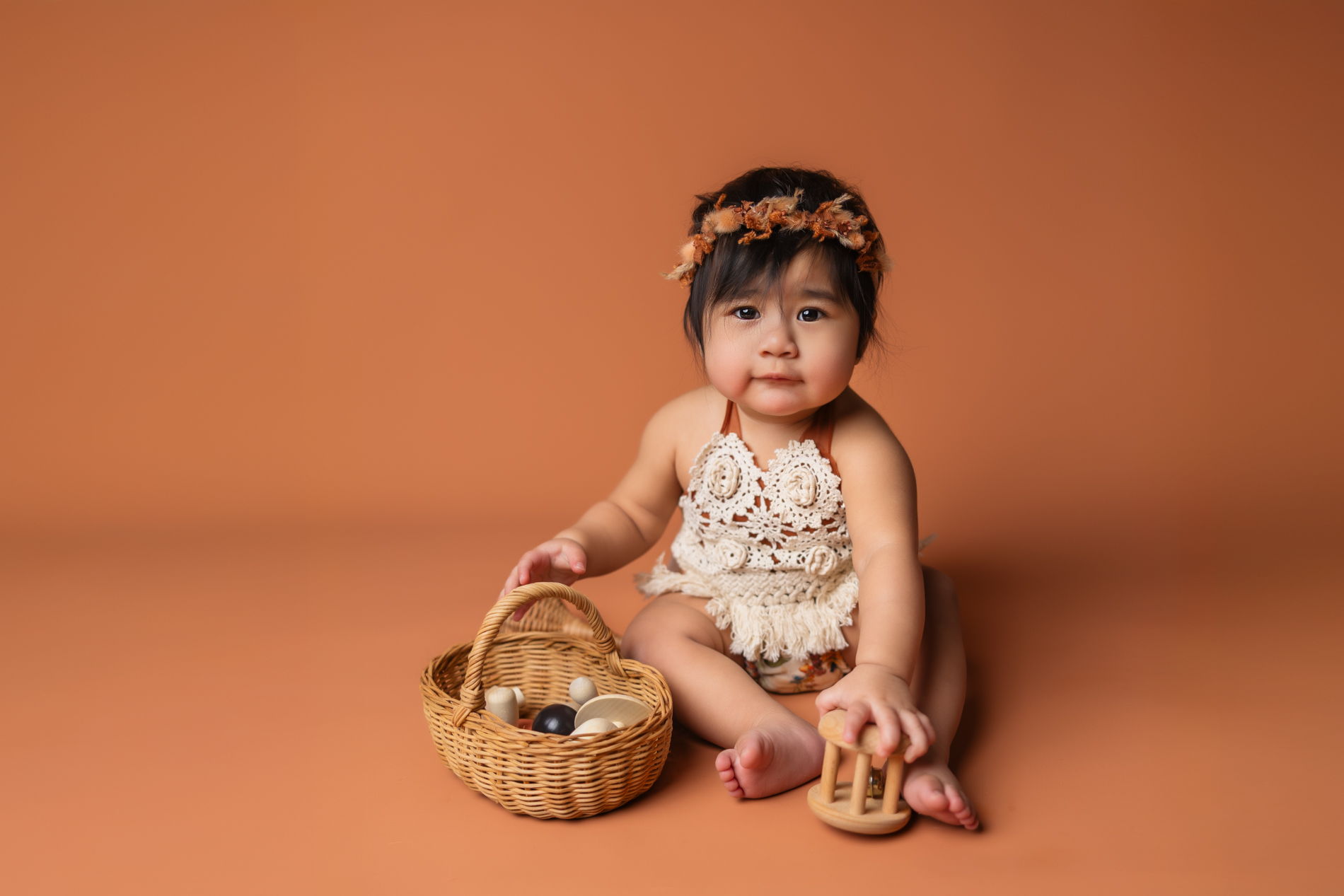 baby-girl-in-rust-color-boho-outfit-1-year-old-milstone-photo-session-triad-baby-photographer