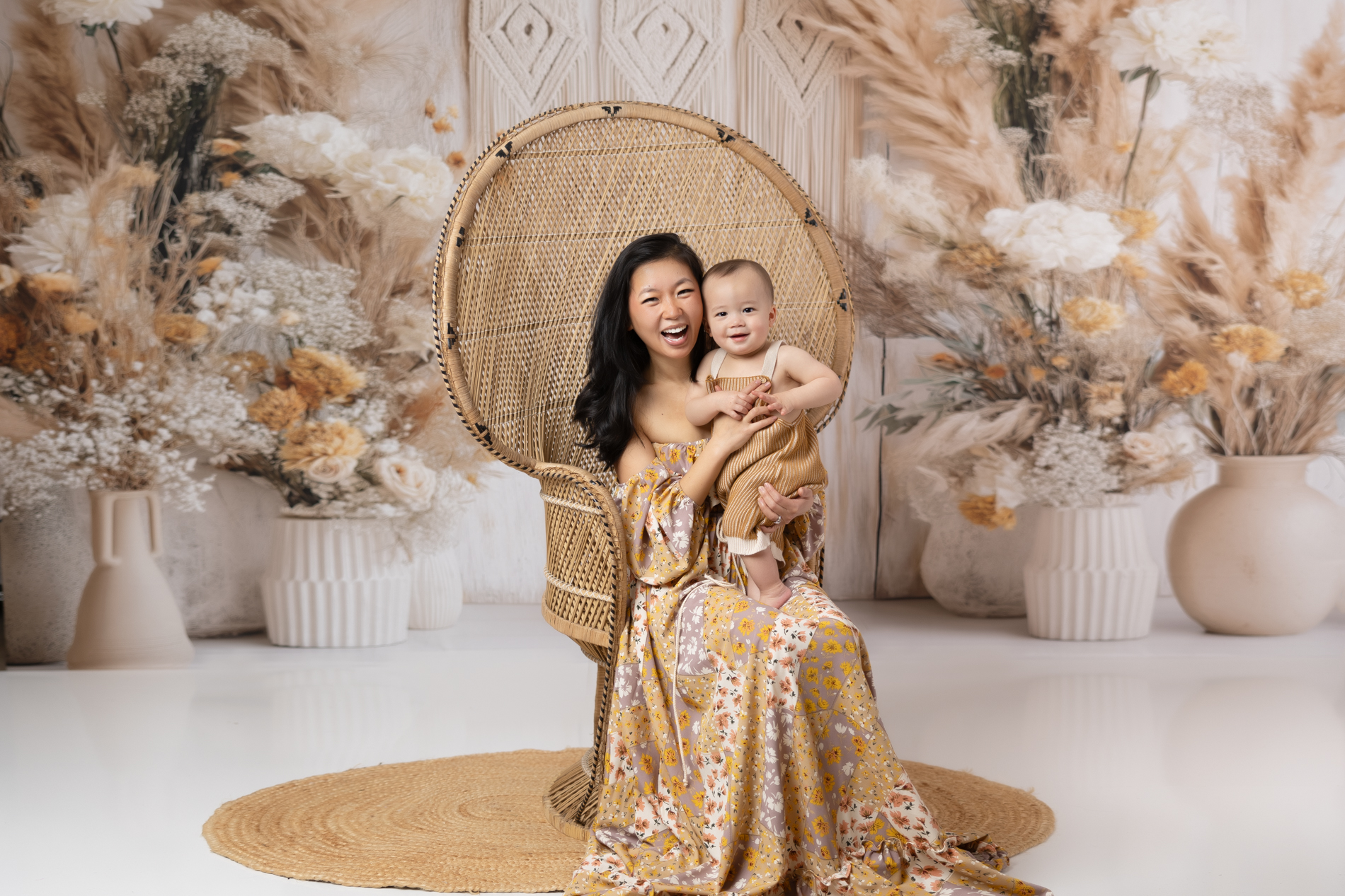 mommy-with-baby-on-peacock-chair-boho-background-winston-salem-baby-family-photo-sesion