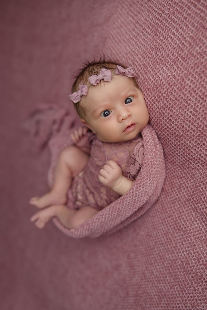 newborn-baby-girl-photo-session-in pink background and pink outfit with-winston-salem-newborn-photographer