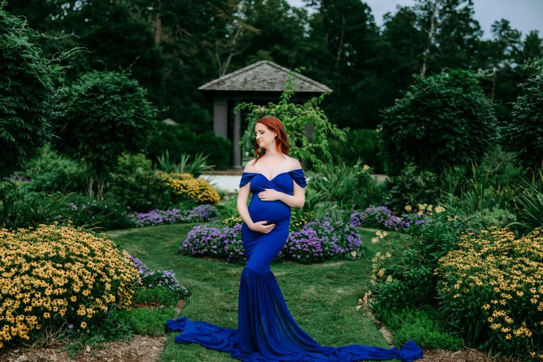 reynolda-garden-maternity-session-pregnant-mother-wearing-blue-fitted-dress-in-front-of-garden-gazebo-winston-salem-family-photographer
